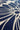 A close-up of a navy blue fabric with a cream-colored abstract floral or sunburst pattern.