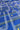 Blue fabric with a geometric pattern of white and yellow lines and circular motifs.