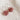 A pair of silver hoop earrings with faceted dusty rose pink flower-shaped 