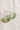 Green and white checkered circular drop earrings with thin silver hoop backings, 