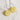 A pair of handmade hoop earrings with round, translucent yellow 