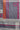A close-up of a textured gray fabric with a geometric pattern featuring white curved stripes, vertical orange and magenta stripes, and magenta circular accents.