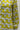 long-sleeve button-front garment featuring a bold retro floral pattern in yellow, white, and gray.