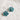 A pair of silver hoop earrings with faceted teal blue flower-shaped drops, 
