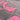 A close-up of a patterned fabric or wallpaper featuring a bright pink tropical leaf design on a dark gray background, with a rolled section at the top showing the material's edge.